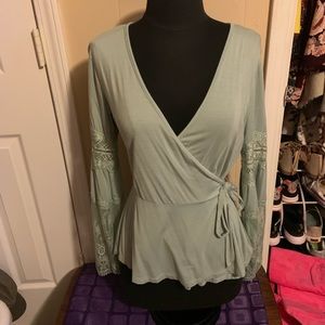 Cross front bell sleeve peplum top